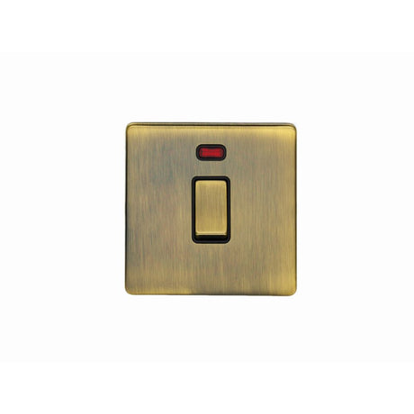 This is an image showing Eurolite Concealed 3mm 20Amp Switch with Neon Indicator - Antique Brass (With Black Trim) ab20adpswnb available to order from trade door handles, quick delivery and discounted prices.