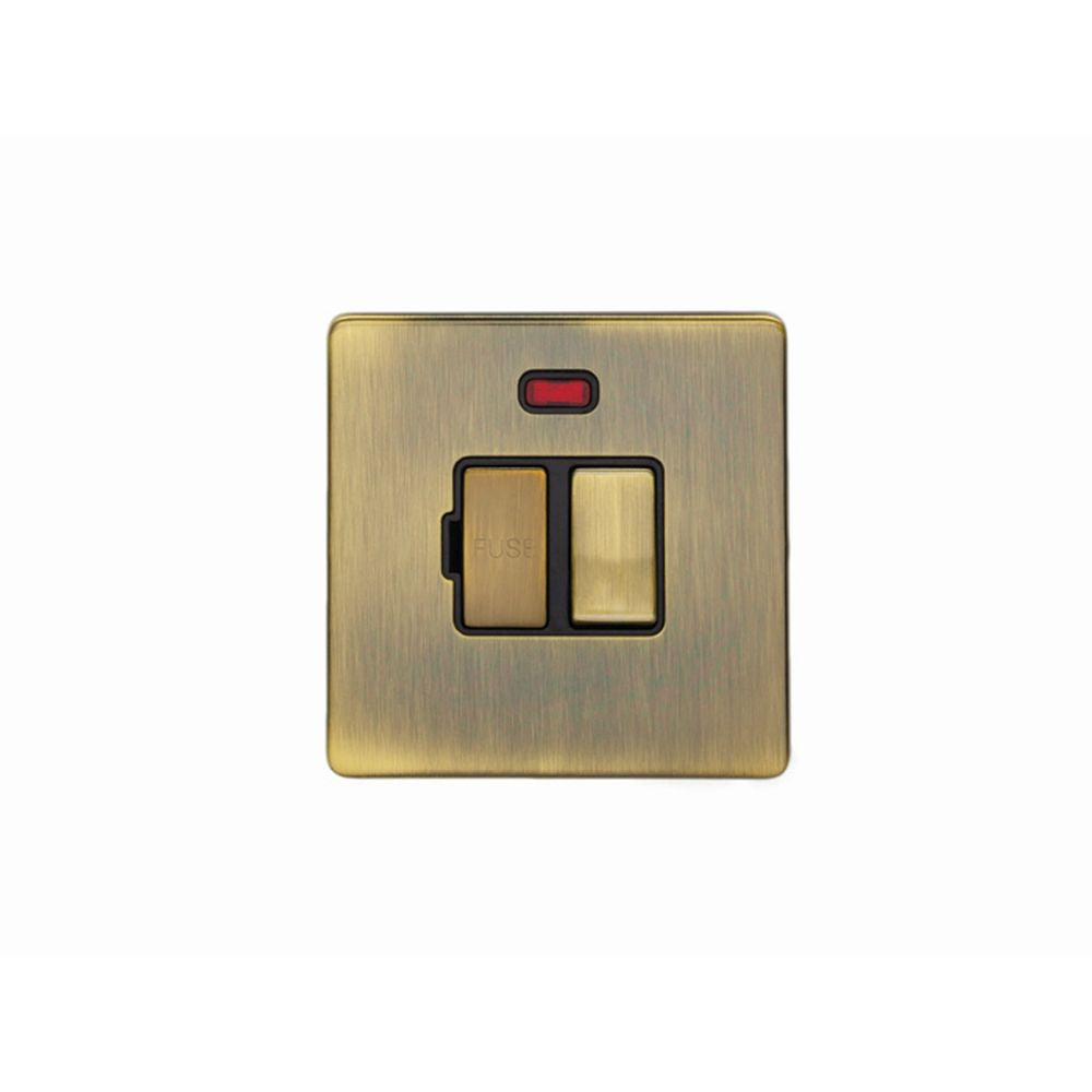 This is an image showing Eurolite Concealed 3mm Switched Fuse Spur - Antique Brass (With Black Trim) abswfnb available to order from trade door handles, quick delivery and discounted prices.