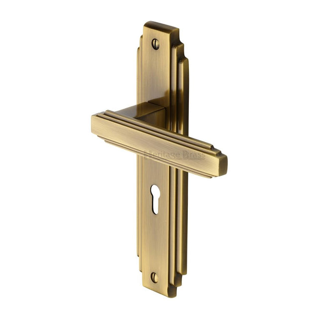 This is an image of a Heritage Brass - Door Handle Lever Lock Astoria Design Antique Brass Finish, ast5900-at that is available to order from Trade Door Handles in Kendal.