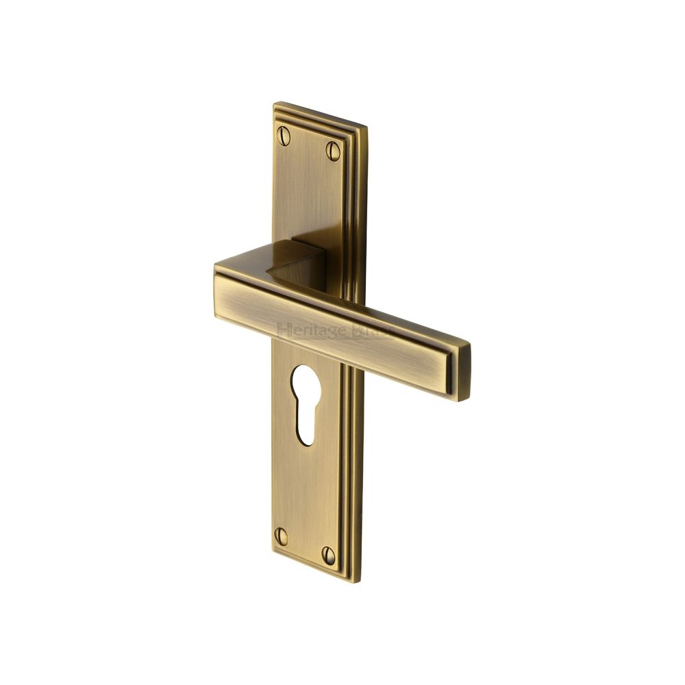 This is an image of a Heritage Brass - Door Handle Euro Profile Atlantis Design Antique Brass Finish, atl5748-at that is available to order from Trade Door Handles in Kendal.