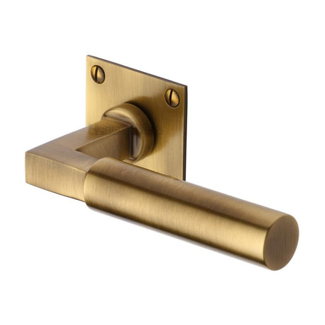 This is an image of a Heritage Brass - Door Handle Lever Latch on Square Rose Bauhaus Design Antique Bras, bau1926-at that is available to order from Trade Door Handles in Kendal.