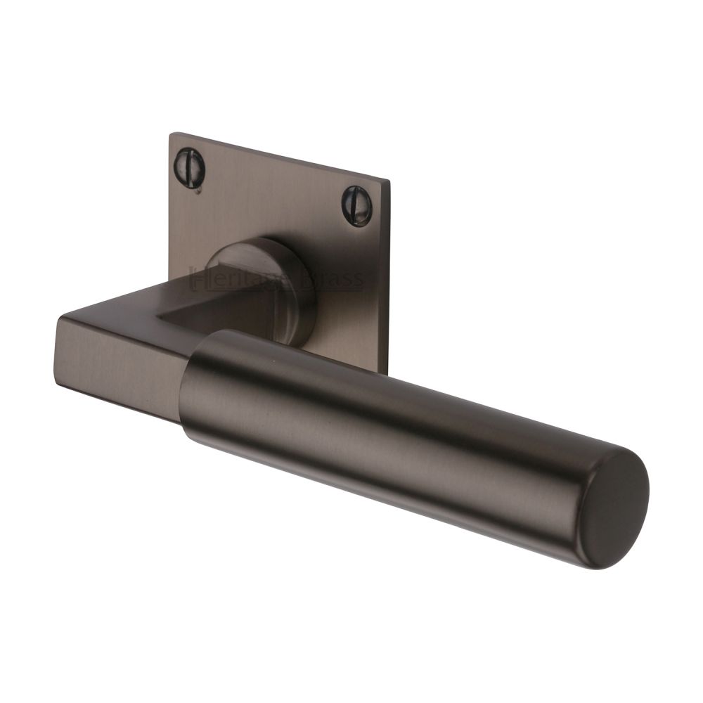 This is an image of a Heritage Brass - Door Handle Lever Latch on Square Rose Bauhaus Design Matt Bron, bau1926-mb that is available to order from Trade Door Handles in Kendal.