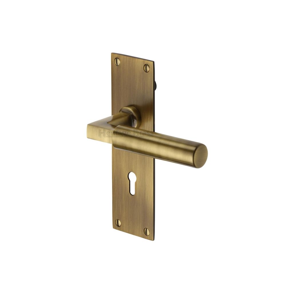 This is an image of a Heritage Brass - Door Handle Lever Lock Bauhaus Design Antique Brass Finish, bau7300-at that is available to order from Trade Door Handles in Kendal.