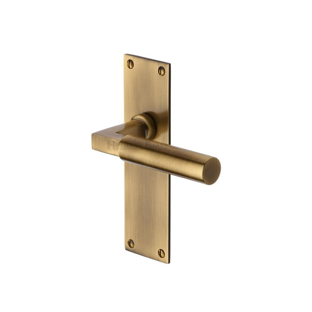 This is an image of a Heritage Brass - Door Handle Lever Latch Bauhaus Design Antique Brass Finish, bau7310-at that is available to order from Trade Door Handles in Kendal.