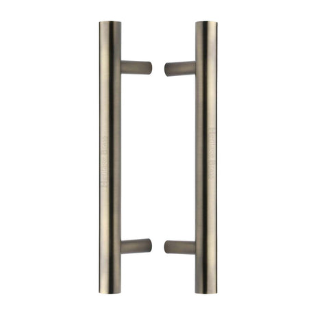 This is an image of a Heritage Brass - Back to Back Door Pull Handle Bar Design 305mm Antique Brass Finish, btb1361-305-at that is available to order from Trade Door Handles in Kendal.