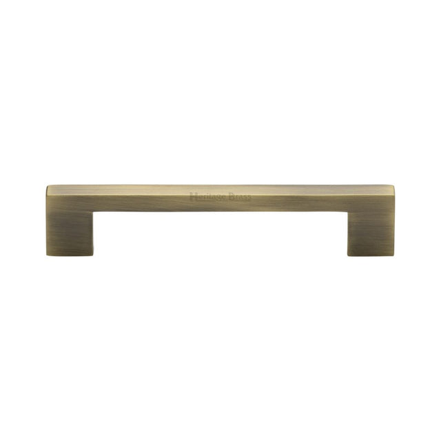 This is an image of a Heritage Brass - Cabinet Pull Metro Design 128mm CTC Antique Brass Finish, c0337-128-at that is available to order from Trade Door Handles in Kendal.