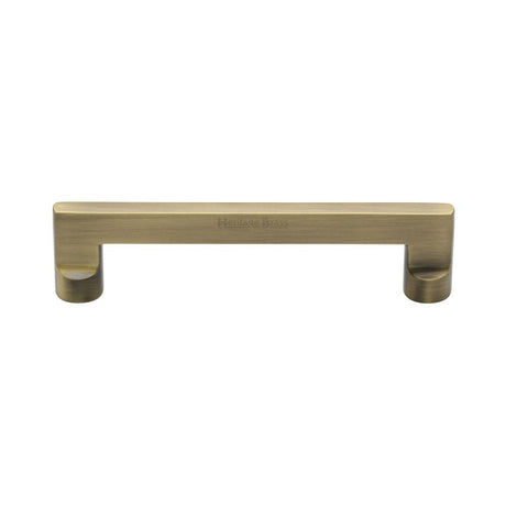 This is an image of a Heritage Brass - Cabinet Pull Apollo Design 128mm CTC Antique Brass Finish, c0345-128-at that is available to order from Trade Door Handles in Kendal.