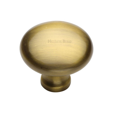 This is an image of a Heritage Brass - Cabinet Knob Victorian Round Design 38mm Antique Brass Finish, c113-38-at that is available to order from Trade Door Handles in Kendal.