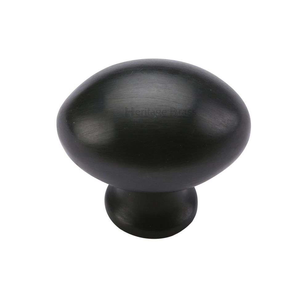 This is an image of a Heritage Brass - Cabinet Knob Victorian Oval Design 32mm Matt Black Finish, c114-32-bkmt that is available to order from Trade Door Handles in Kendal.