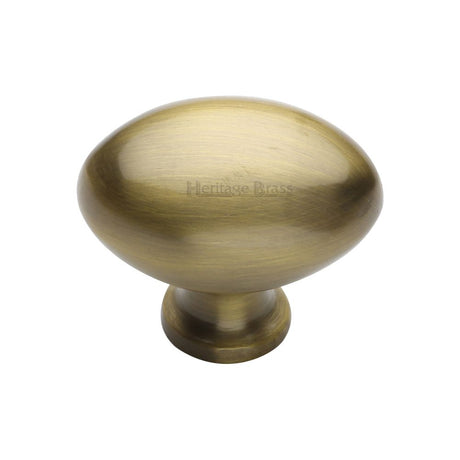 This is an image of a Heritage Brass - Cabinet Knob Victorian Oval Design 38mm Antique Brass Finish, c114-38-at that is available to order from Trade Door Handles in Kendal.