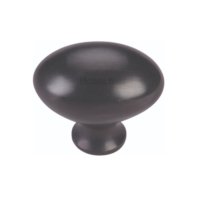 This is an image of a Heritage Brass - Cabinet Knob Victorian Oval Design 38mm Matt Black Finish, c114-38-bkmt that is available to order from Trade Door Handles in Kendal.