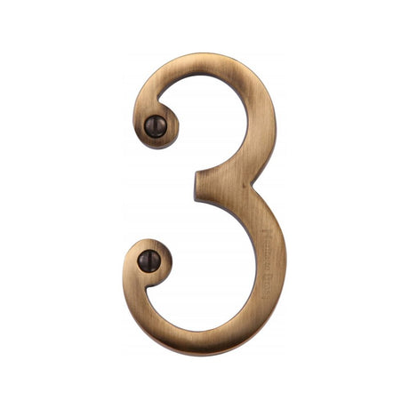 This is an image of a Heritage Brass - Numeral 3 Face Fix 76mm (3") Antique Brass Finish, c1560-3-at that is available to order from Trade Door Handles in Kendal.