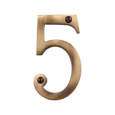 This is an image of a Heritage Brass - Numeral 5 Face Fix 76mm (3") Antique Brass Finish, c1560-5-at that is available to order from Trade Door Handles in Kendal.