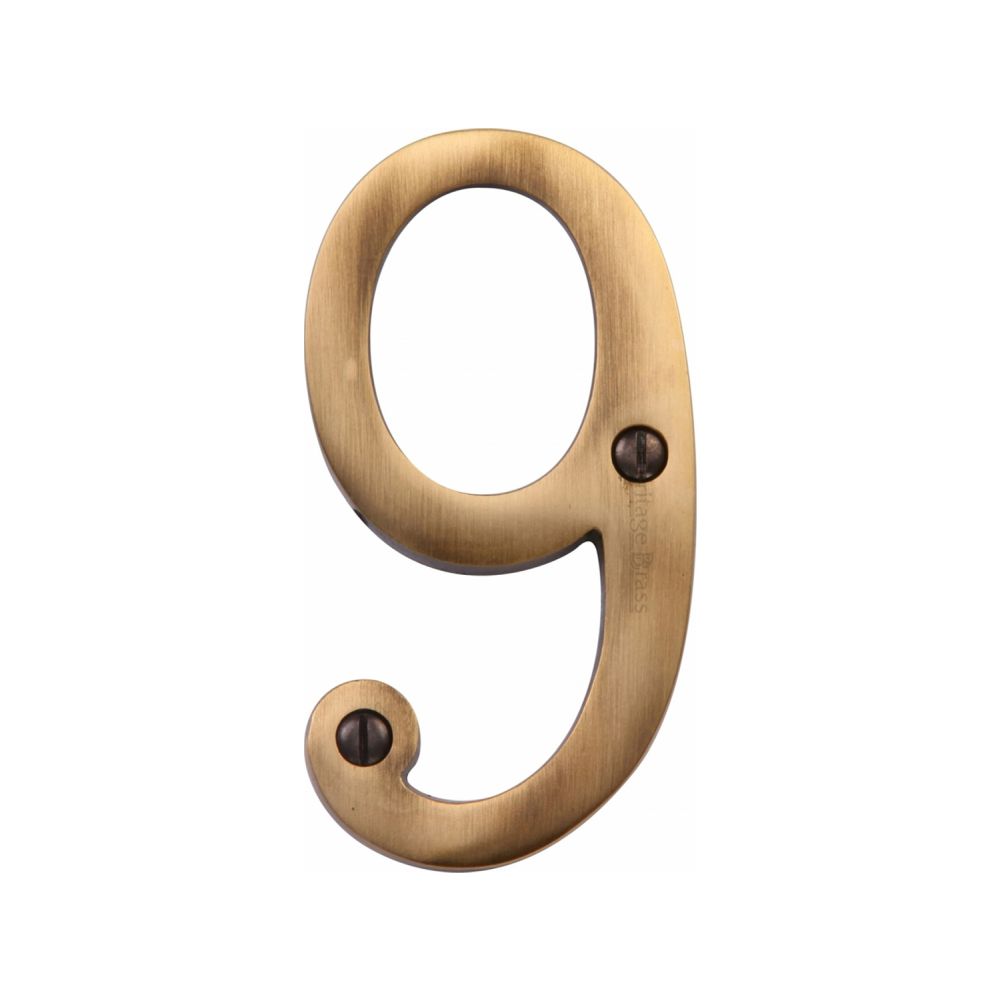 This is an image of a Heritage Brass - Numeral 9 Face Fix 76mm (3") Antique Brass Finish, c1560-9-at that is available to order from Trade Door Handles in Kendal.