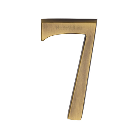 This is an image of a Heritage Brass - Numeral 7 Concealed Fix 76mm (3") Antique Brass finish, c1564-7-at that is available to order from Trade Door Handles in Kendal.