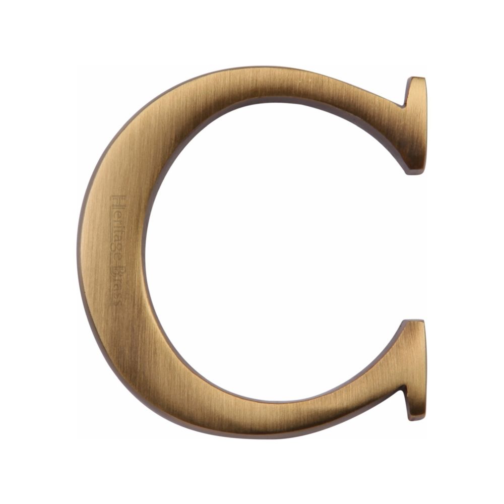 This is an image of a Heritage Brass - Alphabet C Pin Fix 51mm (2") Antique Brass Finish, c1565-2-c-at that is available to order from Trade Door Handles in Kendal.