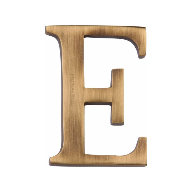 This is an image of a Heritage Brass - Alphabet E Pin Fix 51mm (2") Antique Brass Finish, c1565-2-e-at that is available to order from Trade Door Handles in Kendal.