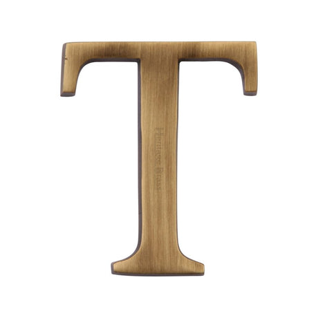 This is an image of a Heritage Brass - Alphabet T Pin Fix 51mm (2") Antique Brass Finish, c1565-2-t-at that is available to order from Trade Door Handles in Kendal.