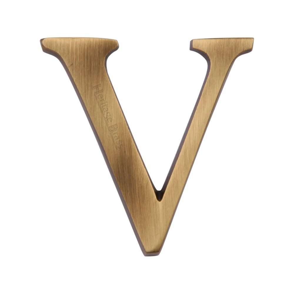 This is an image of a Heritage Brass - Alphabet V Pin Fix 51mm (2") Antique Brass Finish, c1565-2-v-at that is available to order from Trade Door Handles in Kendal.