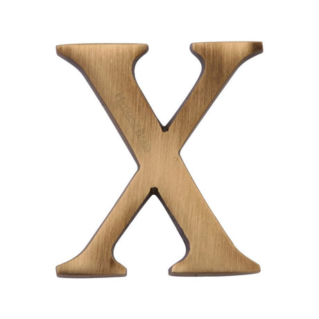 This is an image of a Heritage Brass - Alphabet X Pin Fix 51mm (2") Antique Brass Finish, c1565-2-x-at that is available to order from Trade Door Handles in Kendal.