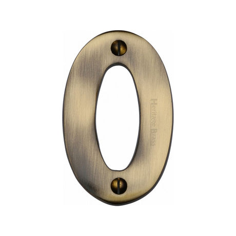 This is an image of a Heritage Brass - Numeral 0 Face Fix 76mm (3") Antique Brass Finish, c1566-0-at that is available to order from Trade Door Handles in Kendal.