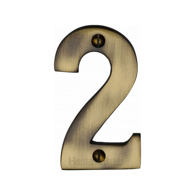 This is an image of a Heritage Brass - Numeral 2 Face Fix 76mm (3") Antique Brass Finish, c1566-2-at that is available to order from Trade Door Handles in Kendal.