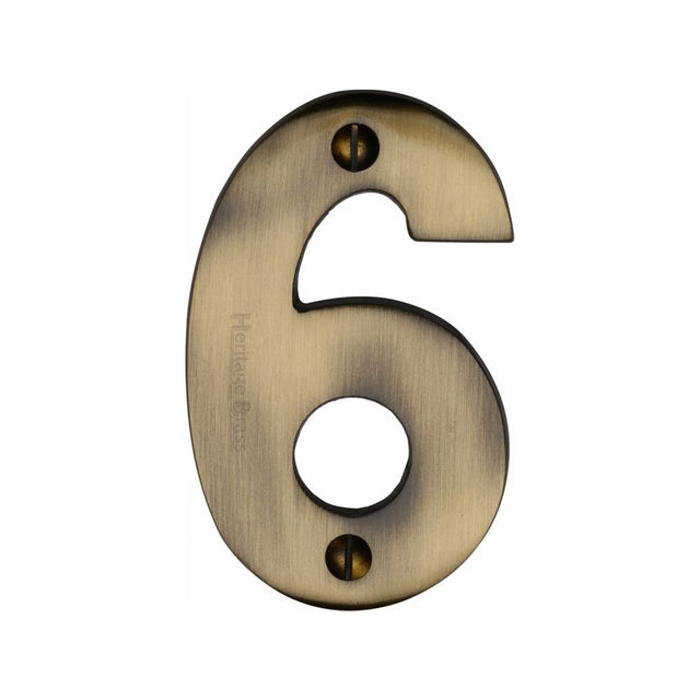 This is an image of a Heritage Brass - Numeral 6 Face Fix 76mm (3") Antique Brass Finish, c1566-6-at that is available to order from Trade Door Handles in Kendal.