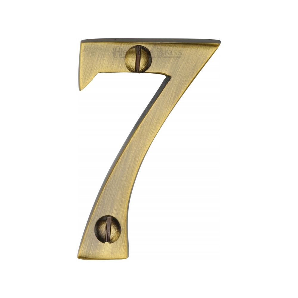 This is an image of a Heritage Brass - Numeral 7 Face Fix 51mm (2") Antique Brass Finish, c1567-7-at that is available to order from Trade Door Handles in Kendal.