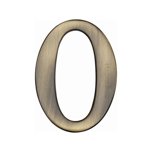 This is an image of a Heritage Brass - Numeral 0 Self Adhesive 51mm (2") Antique Brass Finish, c1568-0-at that is available to order from Trade Door Handles in Kendal.