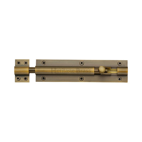 This is an image of a Heritage Brass - Door Bolt Straight 6" x 1.5" Antique Brass Finish, c1584-6-at that is available to order from Trade Door Handles in Kendal.