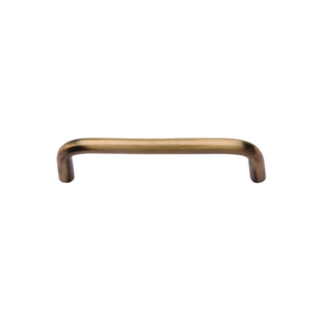 This is an image of a Heritage Brass - Cabinet Pull Wire Design 96mm CTC Antique Brass Finish, c2155-96-at that is available to order from Trade Door Handles in Kendal.