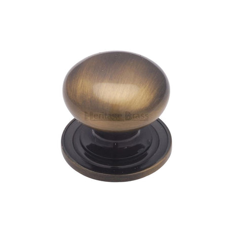 This is an image of a Heritage Brass - Cabinet Knob Victorian Round Design with base 25mm Antique Brass F, c2240-25-at that is available to order from Trade Door Handles in Kendal.