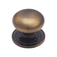 This is an image of a Heritage Brass - Cabinet Knob Victorian Round Design with base 48mm Antique Brass F, c2240-48-at that is available to order from Trade Door Handles in Kendal.