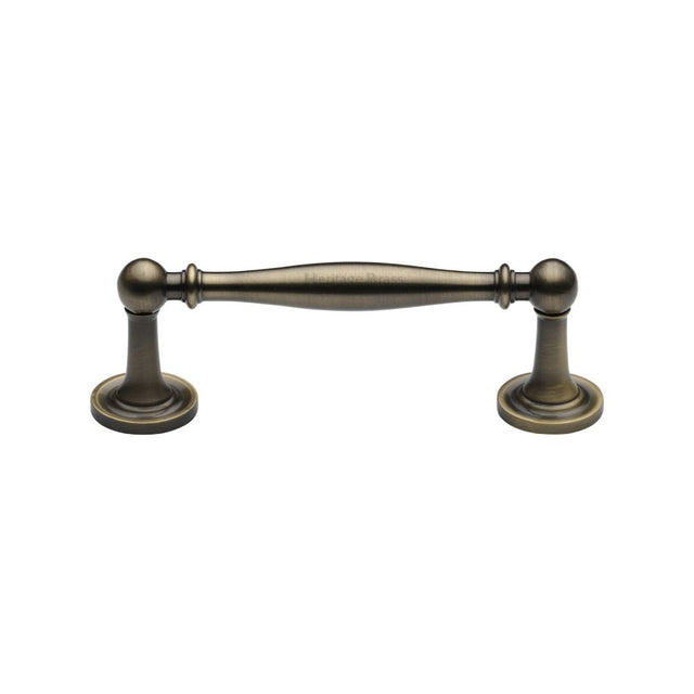 This is an image of a Heritage Brass - Cabinet Pull Colonial Design 96mm CTC Antique Brass Finish, c2533-96-at that is available to order from Trade Door Handles in Kendal.