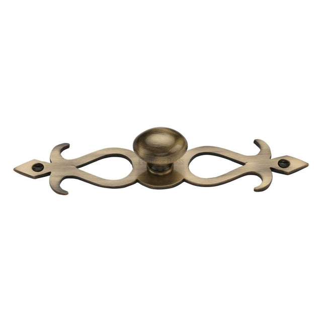 This is a image of a Heritage Brass - Cabinet Knob Oval/Backplate Design 32mm Ant. Brass Finish that is available to order from Trade Door Handles in Kendal