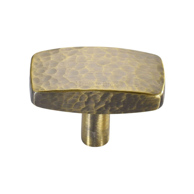 This is a image of a Heritage Brass - Cabinet Knob Rectangular Hammered Design 41mm Ant. Brass Finish that is available to order from Trade Door Handles in Kendal
