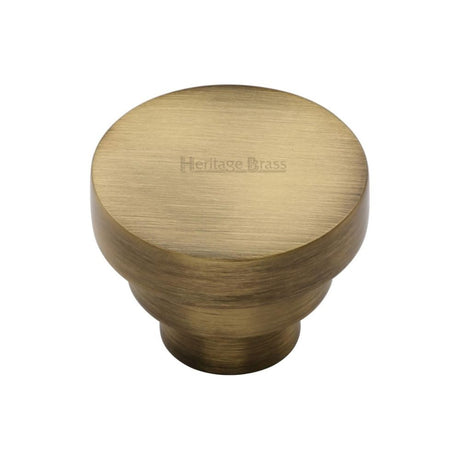 This is an image of a Heritage Brass - Cabinet Knob Round Stepped Design 32mm Antique Brass Finish, c3624-32-at that is available to order from Trade Door Handles in Kendal.