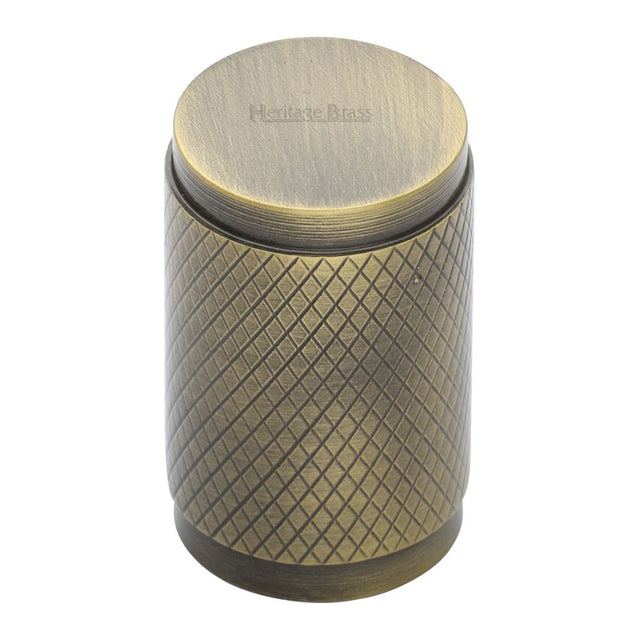 This is an image of a Heritage Brass - Cabinet Knob Cylindric Knurled Design 21mm Antique Brass Finish, c3840-at that is available to order from Trade Door Handles in Kendal.