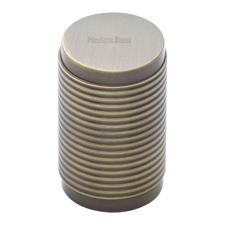 This is an image of a Heritage Brass - Cabinet Knob Cylindric Ribbed Design 21mm Antique Brass Finish, c3850-at that is available to order from Trade Door Handles in Kendal.