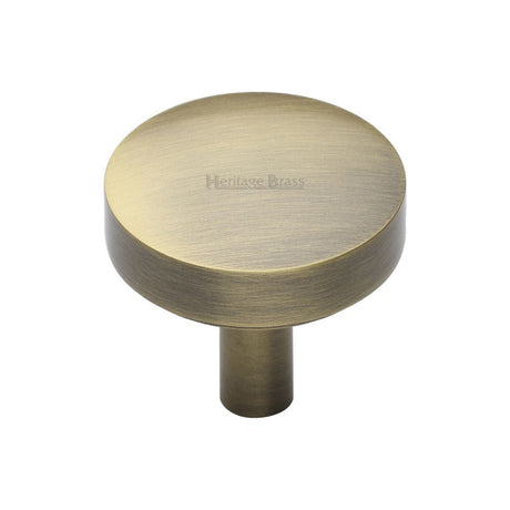 This is an image of a Heritage Brass - Cabinet Knob Domed Disc Design 32mm Antique Brass Finish, c3875-32-at that is available to order from Trade Door Handles in Kendal.