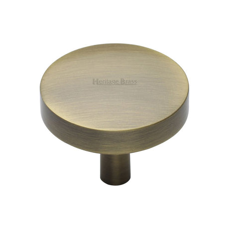 This is an image of a Heritage Brass - Cabinet Knob Domed Disc Design 38mm Antique Brass Finish, c3875-38-at that is available to order from Trade Door Handles in Kendal.