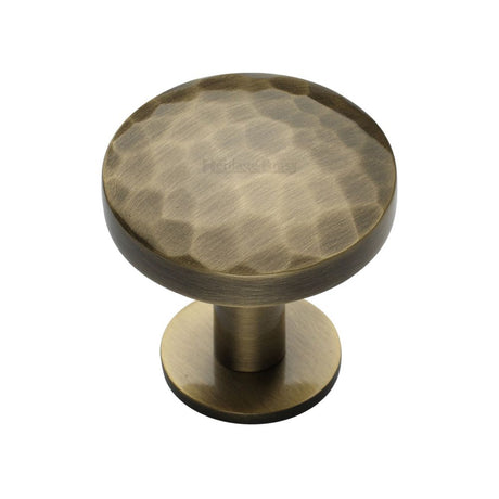 This is an image of a Heritage Brass - Cabinet Knob Round Hammered Design with Rose 32mm Antique Brass Fi, c3876-32-at that is available to order from Trade Door Handles in Kendal.