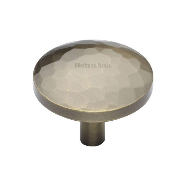 This is a image of a Heritage Brass - Cabinet Knob Round Hammered Design 38mm Ant. Brass Finish that is available to order from Trade Door Handles in Kendal