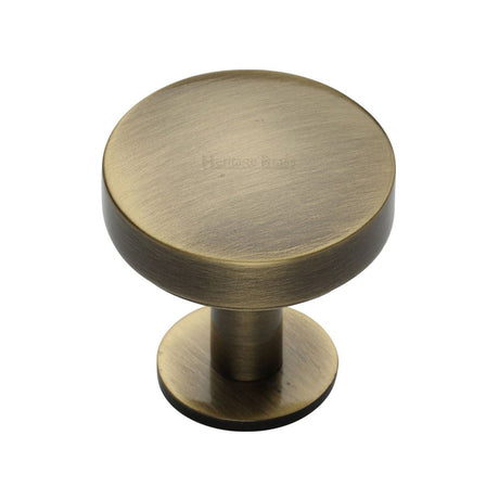 This is an image of a Heritage Brass - Cabinet Knob Domed Disc Design with Rose 32mm Antique Brass Finish, c3878-32-at that is available to order from Trade Door Handles in Kendal.