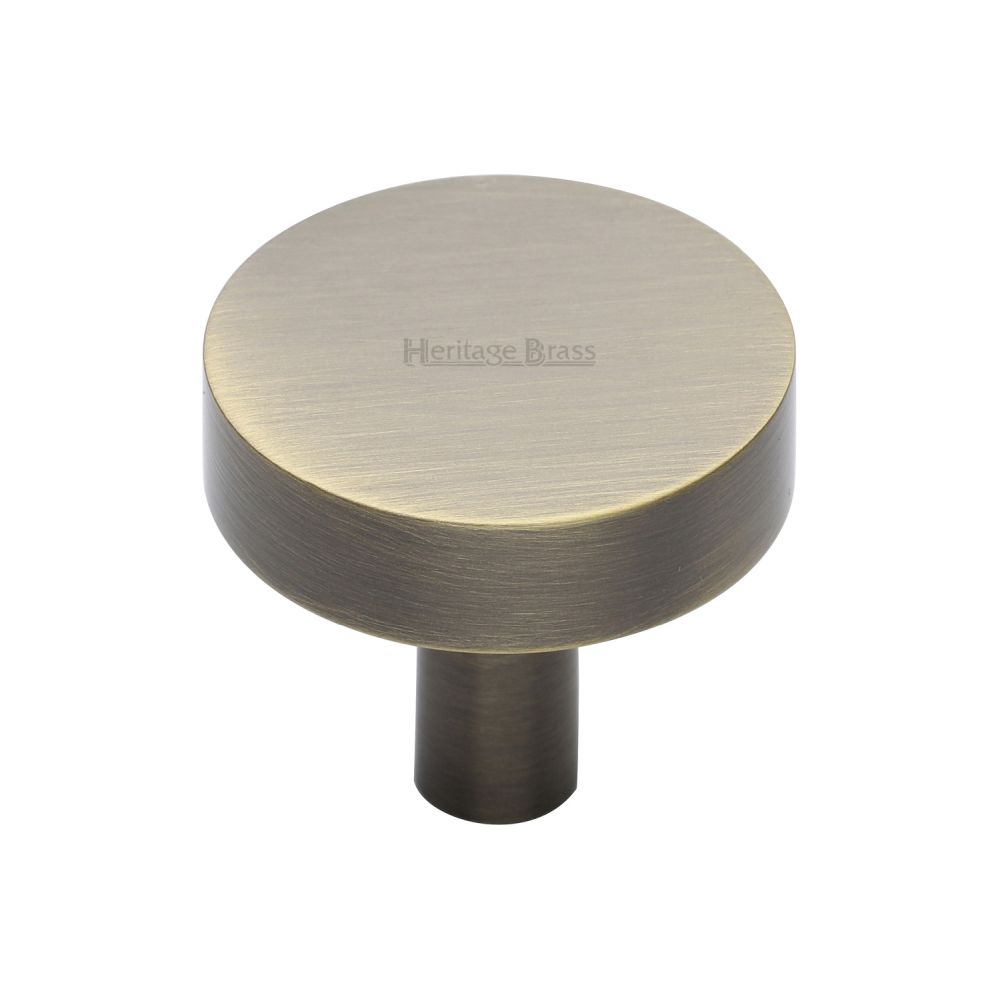 This is an image of a Heritage Brass - Cabinet Knob Disc Design 32mm Antique Brass Finish, c3880-32-at that is available to order from Trade Door Handles in Kendal.