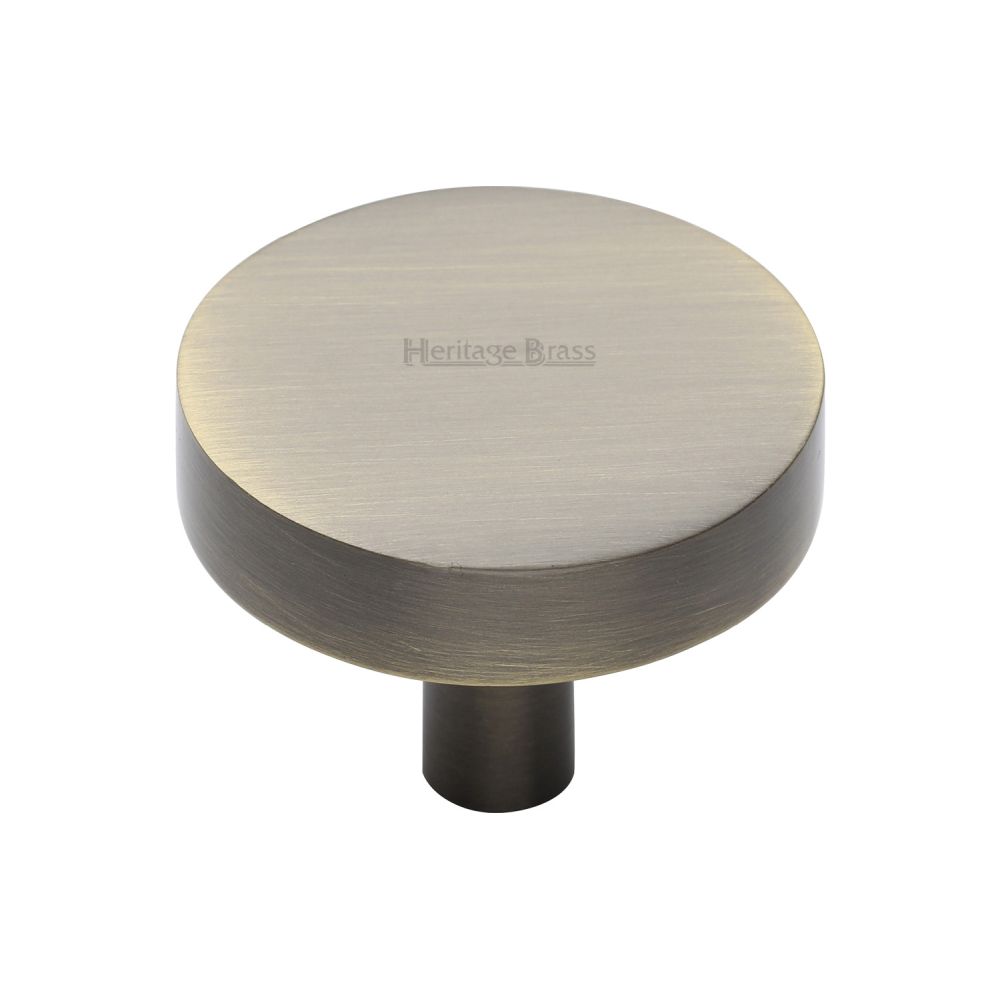 This is a image of a Heritage Brass - Cabinet Knob Disc Design 38mm Ant. Brass Finish that is available to order from Trade Door Handles in Kendal