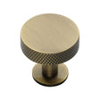 This is a image of a Heritage Brass - Cabinet Knob Disc Knurled Design with Rose 32mm Ant. Brass Fini that is available to order from Trade Door Handles in Kendal