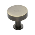 This is a image of a Heritage Brass - Cabinet Knob Disc Design with Rose 38mm Ant. Brass Finish that is available to order from Trade Door Handles in Kendal