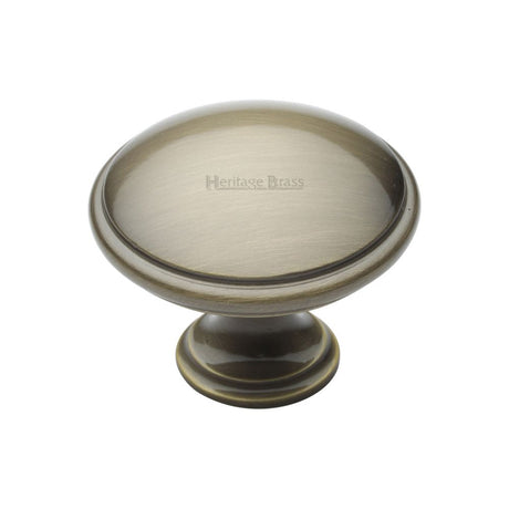 This is an image of a Heritage Brass - Cabinet Knob Domed Design 38mm Antique Brass Finish, c3950-38-at that is available to order from Trade Door Handles in Kendal.