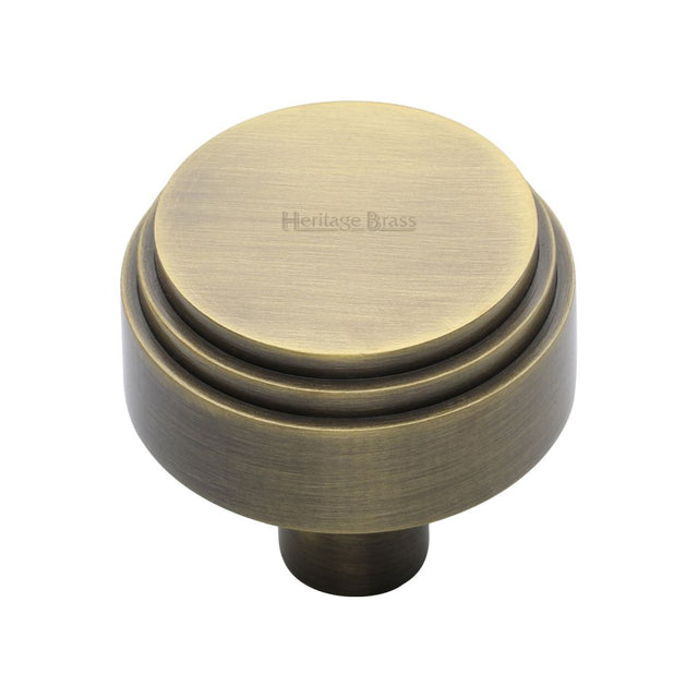 This is an image of a Heritage Brass - Cabinet Knob Round Deco Design 38mm Antique Brass Finish, c3987-38-at that is available to order from Trade Door Handles in Kendal.